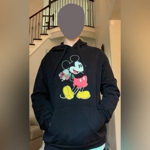 Black hoodie with Mickey Mouse holding flowers